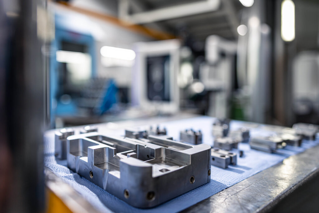A precisely machined metal injection mold lies on a table in the workshop of Schröder and Heidler.